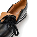 Close-up of Alfie & Evie Hosting Womens Leather Shoe Platform in black silver, featuring a tan interior, black laces, decorative side zipper, and a striped lightweight platform. THE FIVE brand name is visible inside the shoe., 50827, 50828, 50829, 50830, 50831, 50832, 50833