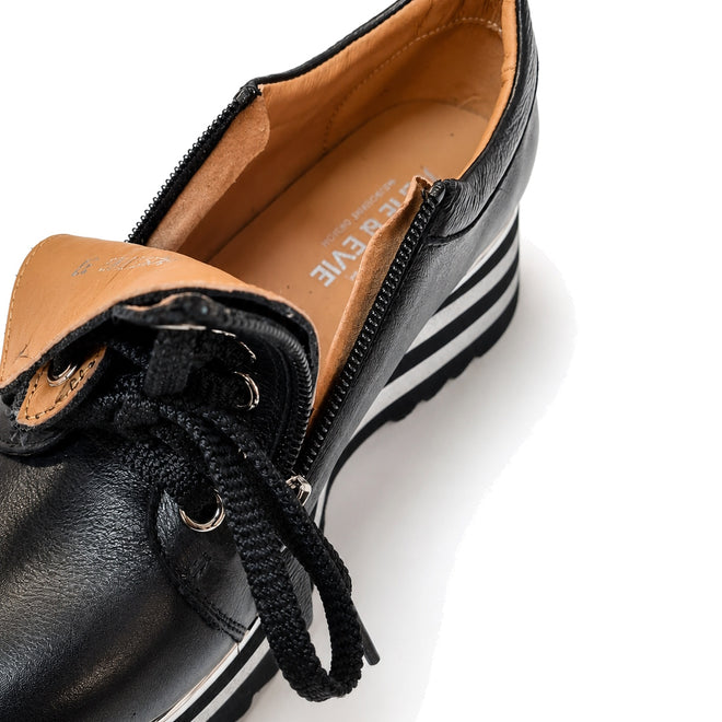 Close-up of Alfie & Evie Hosting Womens Leather Shoe Platform in black silver, featuring a tan interior, black laces, decorative side zipper, and a striped lightweight platform. THE FIVE brand name is visible inside the shoe., 50827, 50828, 50829, 50830, 50831, 50832, 50833