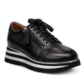 The Alfie & Evie Hosting Womens Leather Shoe Platform Black Silver features black leather, black laces, a side zipper, thick striped sole in black, white, and silver, a rounded toe, and textured outsole for added grip.