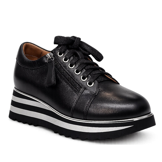 The Alfie & Evie Hosting Womens Leather Shoe Platform Black Silver features black leather, black laces, a side zipper, thick striped sole in black, white, and silver, a rounded toe, and textured outsole for added grip.