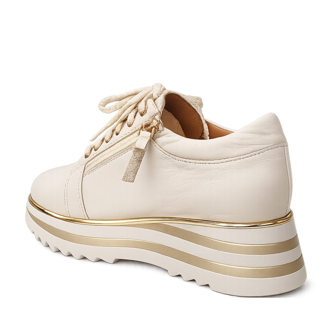 The Alfie & Evie Hosting Womens Leather Shoe in Cream/Gold features a thick striped platform sole, beige laces, side zipper detail, and lightweight leather. Shown here from the back left angle., 38135, 9353738178833, 9353738178840, 9353738178857, 9353738178864, 9353738178871, 38141