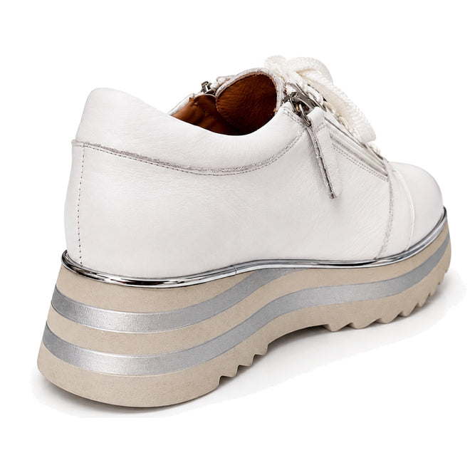 The Alfie & Evie Hosting Womens Leather Shoe Platform in White/Silver features a thick, lightweight sole, silver and beige striped layers, visible stitching, and large white laces, shown from the back and side., 43583, 43584, 43585, 43586, 43587, 43588, 43589