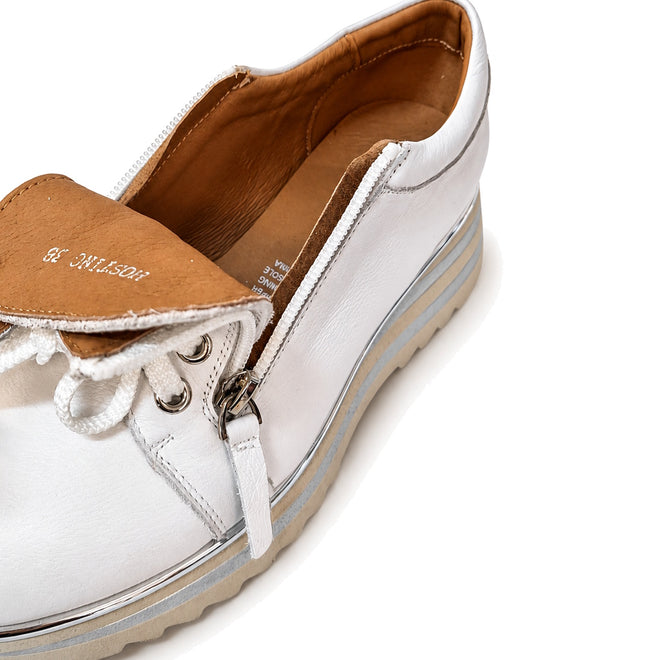 The Alfie & Evie Hosting Women's Leather Shoe in White/Silver features a platform sole, tan interior, side zipper, and top laces. Shown from an angled overhead view against a white background, this shoe blends style and comfort., 43583, 43584, 43585, 43586, 43587, 43588, 43589