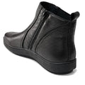 The Alfie & Evie Womens Eagle Black Chelsea Ankle Boot Zip is shown from a rear side angle on a white background, featuring black leather, side zipper, textured surface, thick rubber sole, and a removable memory foam insole., 50841, 50842, 50843, 50844, 50845, 50846, 50847