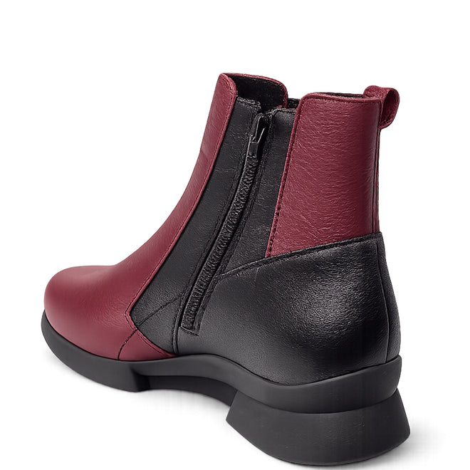 The Alfie & Evie Junior Bordo Purple Lo Leather Ankle Boot features two-tone Bordo Purple Wine leather and black panels, a side zipper, pull tab, chunky black sole, and a memory foam insole. Angled view shows back and side details., 50876, 50877, 50878, 50879, 50880, 50881, 50882