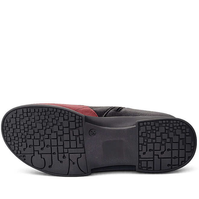 The image displays the sole of the Alfie & Evie Junior Bordo Purple Lo Leather Ankle Boot Womens. The black sole features a red accent, unique textured geometric pattern for grip, and a memory foam insole, with the shoe showing its full underside., 50876, 50877, 50878, 50879, 50880, 50881, 50882
