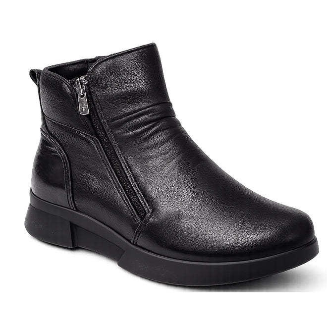 The Alfie & Evie Justice Black Lo Leather Zip Ankle Boot for women features smooth black leather, a side zipper, minimal stitching, a low flat heel, and a removable memory foam insole for comfort. Shown against a white background.