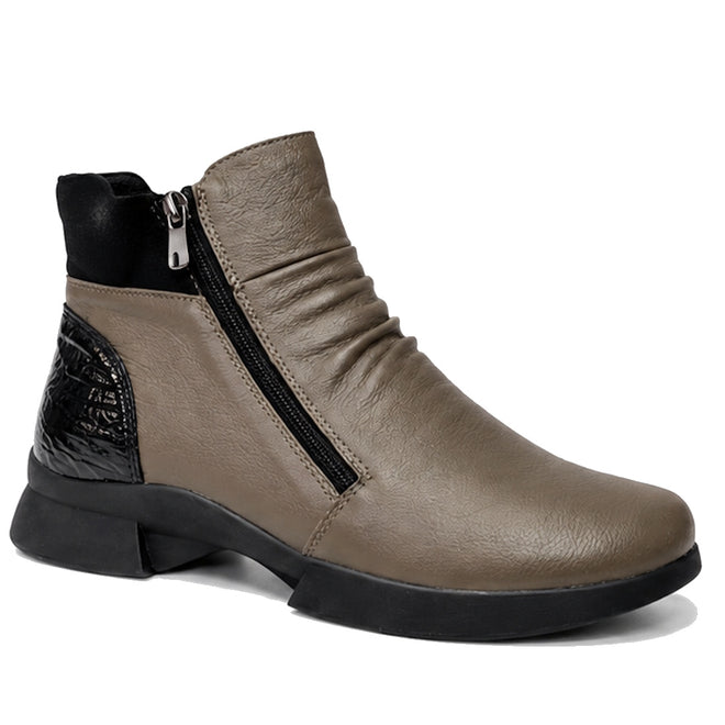 The Alfie & Evie Justice Khaki Lo Leather Zip Ankle Boot for women features a stylish khaki leather upper, black side zipper, textured black heel detail, low chunky heel, rounded toe, and removable memory foam insole for comfort.