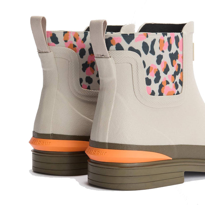 A close-up of the back of two Barbour Abbeyfield Packable Ankle Wellingtons Mist—lightweight ankle boots with multicolored leopard print panels, orange sole accents, and olive green outsoles., 51823, 51824, 5063669171196, 5063669171202, 5063669171219, 51828, 51829