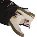 A pair of Barbour Abbeyfield Packable Ankle Wellingtons Mist, beige with olive soles and vibrant leopard print lining, shown partially out of a black drawstring bag with pink Bax branding. Lightweight and ideal for travel or outdoor adventures., 51823, 51824, 5063669171196, 5063669171202, 5063669171219, 51828, 51829