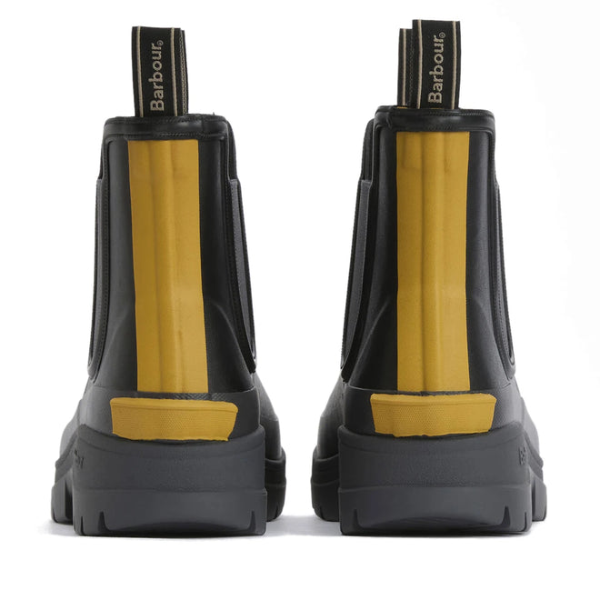 The Barbour Nimbus Black/Ochre Chelsea Wellingtons Men's Rainboot, shown from behind with yellow accents and pull tabs, features chunky soles and visible Barbour branding for stylish, practical waterproof protection., 51444, 5063669168752, 5063669168691, 5063669168707