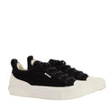 Barbour Mens Stanhope Canvas Lace Up Trainer Black features thick white rubber soles, toe caps, black laces, and a branded side tag—classic canvas sneakers perfect for men's everyday style.