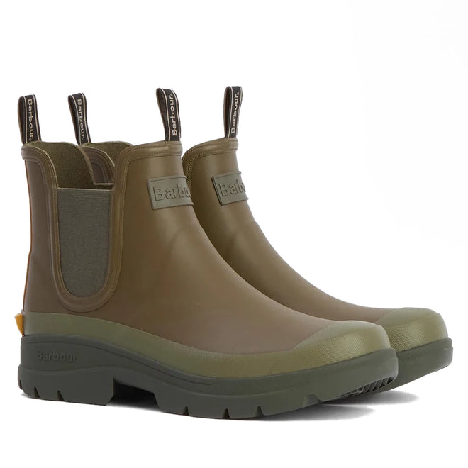 The Barbour Nimbus Olive/Ochre Chelsea Wellingtons Men's Rainboot features pull tabs, elastic side panels, thick textured soles, and the Barbour brand on the front—stylish waterproof ankle boots for any adventure.