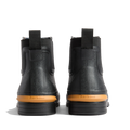 A pair of Barbour Abbeyfield Packable Ankle Wellingtons in black, shown from the back with tan soles, pull tabs, and Barbour branding embossed above the heels—these lightweight ankle wellingtons are ideal as stylish and practical festival boots., 54323, 5063669380451, 5063669380468, 5063669380475, 5063669380482, 5063669380499, 54329