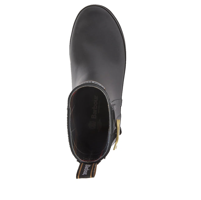 A top-down view of a single Barbour Hepburn Platform Ankle Wellingtons Boot in black, featuring a gold buckle and branded pull tab at the heel, displayed on a white background. This sleek women’s boot highlights the signature style and practicality of Barbour’s platform ankle rain boots., 54330, 54331, 5063669379622, 5063669379639, 5063669379646, 54335, 54336