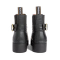 Back view of the Barbour Hepburn Platform Ankle Wellingtons Boots in black, featuring chunky heels, gold side buckles, elastic panels, and Barbour-branded pull tabs. These women’s ankle boots showcase a textured finish on the upper for a stylish update to classic ankle rain boots., 54330, 54331, 5063669379622, 5063669379639, 5063669379646, 54335, 54336