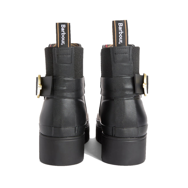 Back view of the Barbour Hepburn Platform Ankle Wellingtons Boots in black, featuring chunky heels, gold side buckles, elastic panels, and Barbour-branded pull tabs. These women’s ankle boots showcase a textured finish on the upper for a stylish update to classic ankle rain boots., 54330, 54331, 5063669379622, 5063669379639, 5063669379646, 54335, 54336