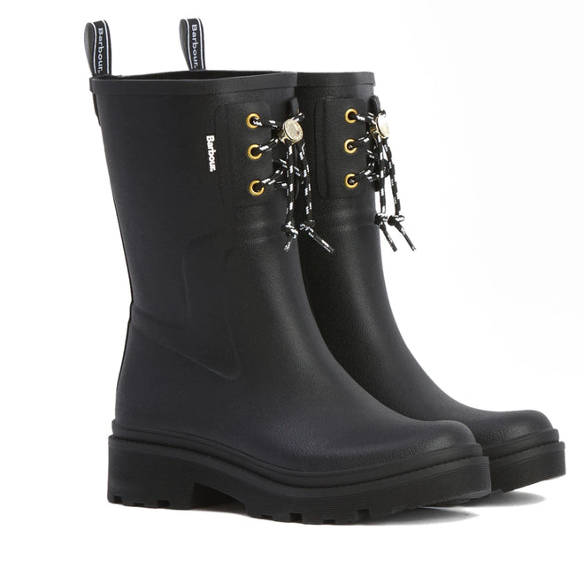 The Barbour Devlin Black Mid Calf Wellys Womens Rainboot features waterproof black uppers, thick soles, gold eyelets, black-and-white laces, side branding, and back pull tabs for easy wear.
