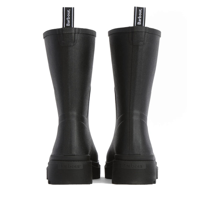 The Barbour Devlin Black Mid Calf Wellys Womens Rainboot, shown from the back, feature Barbour branding on the heel and pull tab, a matte finish, and a chunky sole., 51446, 5063669171547, 5063669171554, 5063669171561, 51450, 51451