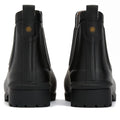Rear view of a pair of Barbour Wilton Black Chelsea Wellingtons Women's Rainboots featuring chunky soles, pull tabs, tartan lining peeking out, and a small round gold detail on the back., 190375411423, 190375411546, 190375411614, 190375411768, 190375411850, 190375412024
