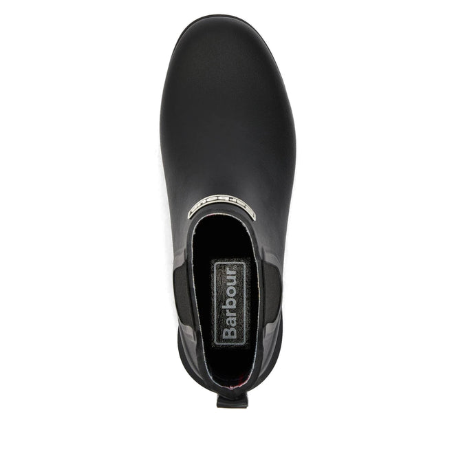 Top view of a single Barbour Wilton Black Chelsea Wellingtons Women's Rainboot featuring a pull tab at the back, tartan lining, and a silver Barbour-branded plate on the front., 190375411423, 190375411546, 190375411614, 190375411768, 190375411850, 190375412024