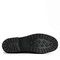 The black rubber sole of the Barbour Wilton Black Chelsea Wellingtons Womens Rainboot is shown from below, revealing a tread with rectangular grooves and cross-shaped grips., 190375411423, 190375411546, 190375411614, 190375411768, 190375411850, 190375412024