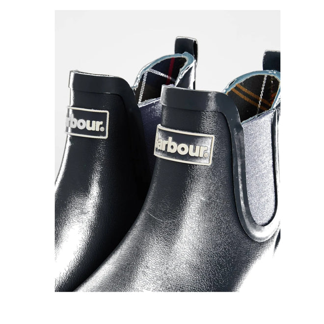 Close-up of two Barbour Wilton Navy Chelsea Wellingtons Womens Rainboots with elastic side panels, tartan linings, Chelsea-boot design, and Barbour logo on the front., 190375411744, 190375411867, 190375412055, 190375412123, 190375412222, 51392