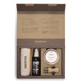 Birkenstock shoe care kit with towel, spray, brush, and cream in a cardboard box.