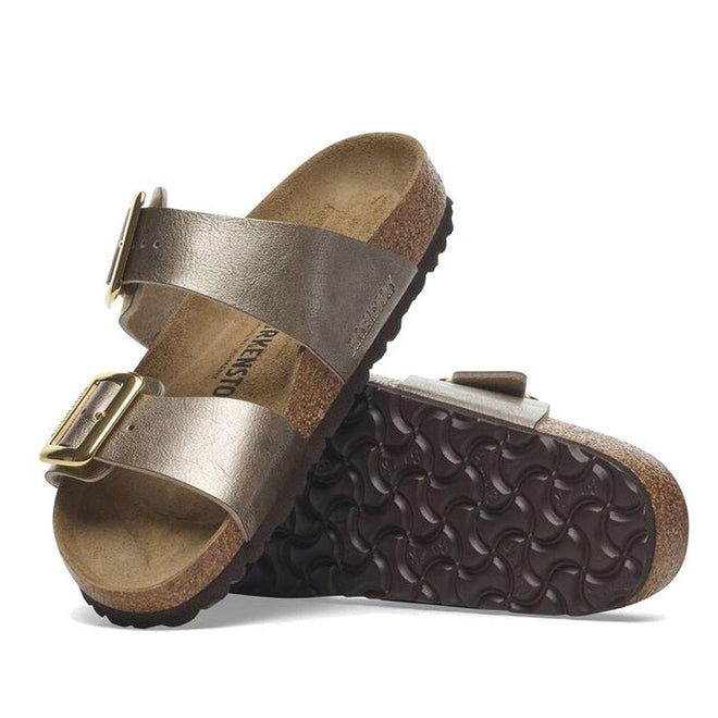 Pair of Arizona Birkenstock brown metallic slide sandals with buckles on a white background