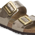 Pair of Birkenstock sandals with gold buckles on a white background,
4066648998228,
4066648998266,
4066648998303,