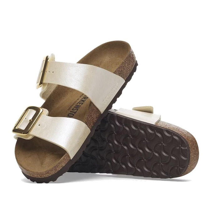 Pair of birkenstock arizona slides sandals with white straps and brown soles on a white background