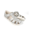 The Bobux Kids Plus KP Tropicana II Metallic Silver Quick Dry Sandal 838320 features closed toes, white soles, and adjustable hook-and-loop ankle straps—ideal summer sandals for kids, shown against a white background.