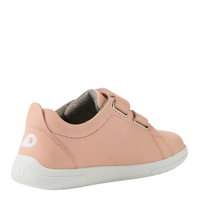 The Bobux KP Kids Plus Grass Court 2 II Leather Sneaker in Seashell is a light pink kids' shoe with two adjustable Velcro straps, a white sole, and a white B logo on the heel, shown from the back on a plain white background., 9420074831538, 9420074831545, 52192, 9420074831569, 9420074831576, 9420074831583, 9420074831590
