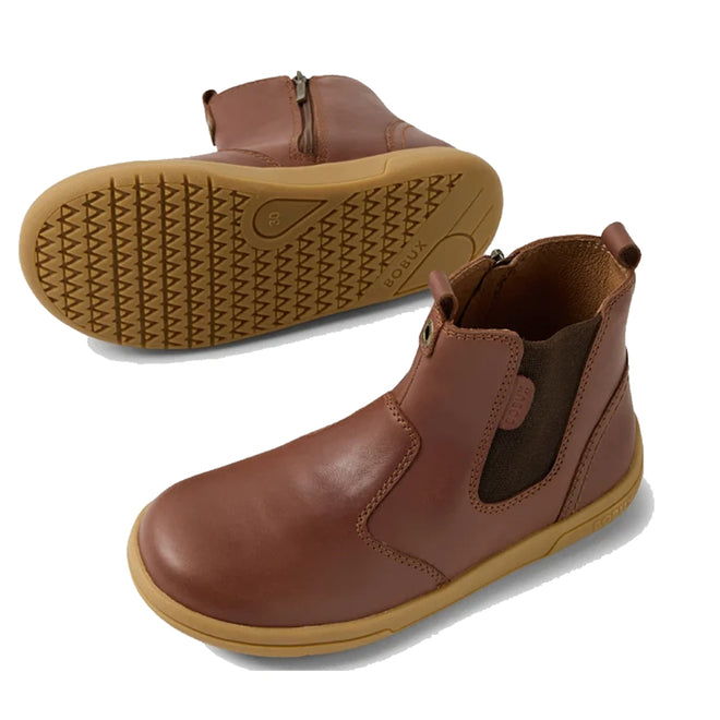 The Bobux KP Kids Plus Jodhpur 2 II Juniors Leather Boot in Toffee features a brown leather upper, tan flexible textured soles, side zippers, and elastic panels. One boot is upright to show front and side; the other shows the sole., 52162, 52163, 52164, 52165, 52166, 9420074835451, 9420074835468