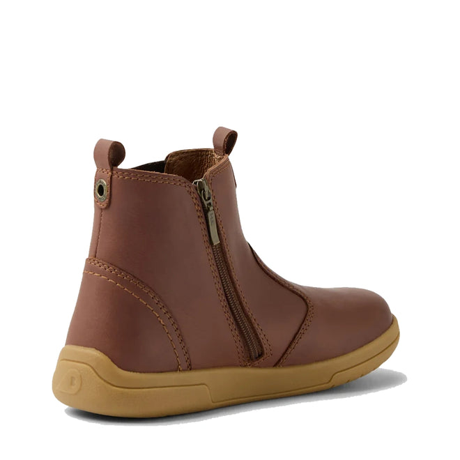 The Bobux KP Kids Plus Jodhpur 2 II Juniors Leather Boot in Toffee features a visible side zipper, pull tabs, stitched accents, and a light tan flexible sole, displayed at an angle on a white background., 52162, 52163, 52164, 52165, 52166, 9420074835451, 9420074835468