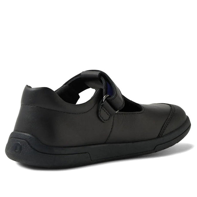 The Bobux Kid+ Black School Leather Shoe Bubbles T Bar features premium black leather, a round toe, scuff-resistant hook-and-loop strap, and a black rubber sole. Shown from the back left against a white background., 48381, 9420074842169, 9420074842176, 9420074842183, 9420074842190, 9420074842206, 9420074842213