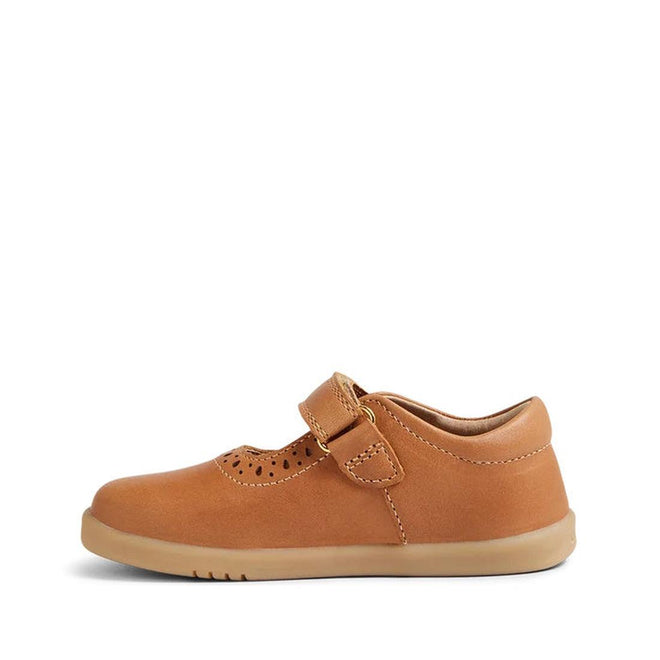 The Bobux Iwalk Lola Toddlers Mary Jane Caramel Tan Leather 652801 is a kids' leather shoe with a flexible rubber sole, toe perforations, and an adjustable hook-and-loop strap, shown from the side on a white background., 9420068549531, 9420068549548, 9420068549555, 9420068549562, 9420068549579