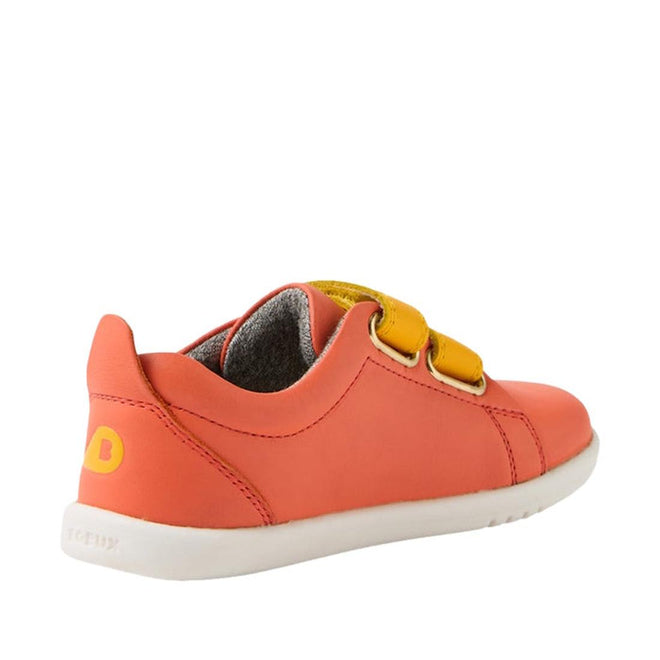 The Bobux Iwalk Grass Court Sneaker Nasturtium Orange 640220 is a unisex kids’ velcro shoe in coral with two yellow straps, a white sole, and gray lining—ideal leather trainers for active children. Shown from the back on a white background., 46605, 46606, 46607, 46608, 46609