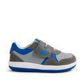 The Bobux IW Iwalk Baseline Leather Sneaker Ultimate Grey is a kids’ leather sneaker in gray and blue, featuring cushioned EVA midsoles, easy hook-and-loop strap closures, a white midsole, and a blue outsole, displayed in side profile on a white background.