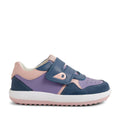 The Bobux IW Iwalk Baseline Leather Sneaker in Purple Haze is a children’s sneaker featuring blue, pink, and purple panels, a white sole with a textured grip, a hook and loop strap for easy fastening, and the signature B logo on the side. Its sporty design is perfect for toddlers.