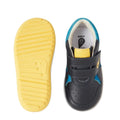 The Bobux IW Iwalk Baseline Leather Mid Sneaker in navy features yellow and blue accents. Shown are a toddler pair: one displays the hook-and-loop strap from the top, the other reveals its textured yellow sole from below., 9420074818560, 9420074818577, 9420074818584, 9420074818591