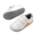 Bobux IW Iwalk Blaze Toddlers Leather Sneaker White Orange: These toddler sneakers feature premium white leather, gray soles, blue heel accents, and a striking orange side detail. Designed for easy on and off with two hook-and-loop Velcro straps, these stylish kids’ shoes combine comfort and functionality—one sneaker is showcased upright while the other displays its textured sole., 9420074851918, 9420074851925, 9420074851932, 9420074851949, 9420074851956