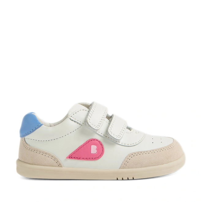 The Bobux IW Iwalk Toddlers Champ Leather Sneaker in White Pink is a stylish children’s sneaker featuring a white leather upper, beige sole, blue heel accent, pink teardrop design with a “B”, and two hook-and-loop straps for easy fastening—shown in side profile on a white background, making it the perfect choice for toddler or kids’ leather sneakers., 9420074856654, 9420074856661, 9420074856678, 9420074856685, 9420074856692