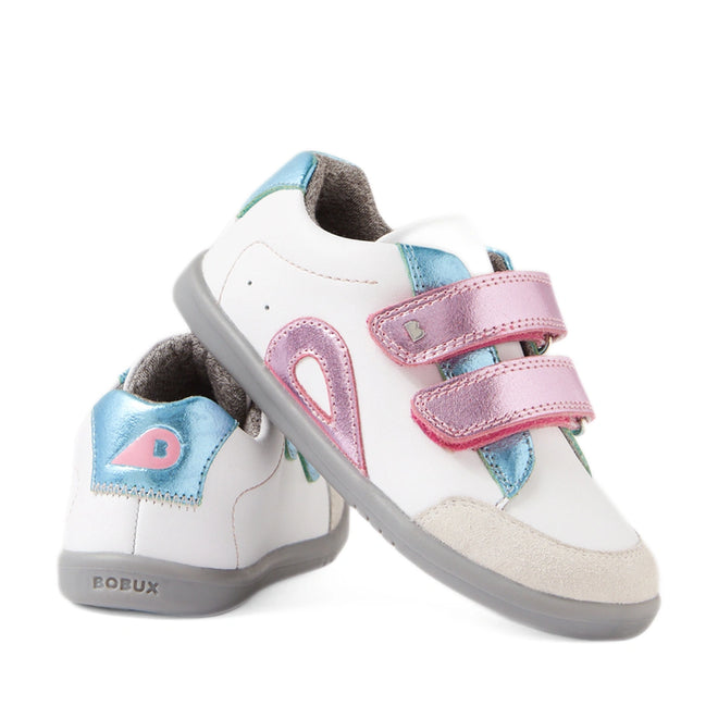 Two white Bobux IW Iwalk Blaze Toddlers Leather Sneakers in Pink Metallic feature gray soles, blue and pink metallic accents, and double pink Velcro straps. One shoe stands upright while the other leans against it, displaying the BOBUX branding on the heel. These sneakers combine style and comfort for your little one.