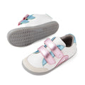 Two Bobux IW Iwalk Blaze Toddlers Leather Sneakers in white leather feature gray soles, pink metallic Velcro straps, and blue metallic accents. One shoe stands upright while the other rests on its side to display the sole—ideal as an everyday sneaker for toddlers., 9420074851987, 9420074851994, 9420074852007, 9420074852014, 9420074852021