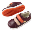 Bobux IW Iwalk Breakpoint Leather Fig Purple kids' sneakers feature maroon and pink leather uppers, an orange strap, and a white-orange sole. One shoe is upright showing the top/side; the other is flipped to reveal its textured sole., 9420074817600, 9420074817617, 9420074817624, 9420074817631