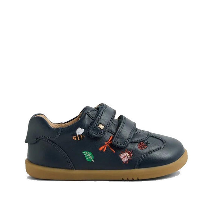 The Bobux Iwalk Buggie Navy Embroidered Toddlers Trainer is a dark blue leather shoe with a tan sole, two velcro straps, and colorful embroidered insect and leaf designs on the side., 9420074829283, 9420074829290, 9420074829306, 9420074829313, 9420074829320