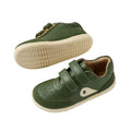 The Bobux IW Iwalk Champ Sneaker Bronze Green features a green design with beige soles, perforated toe detailing, a side logo patch, and two adjustable hook-and-loop Velcro straps for toddler comfort and easy closure., 9420074810786, 9420074810793, 9420074810809, 9420074810816, 9420074810779, 9420074810786, 9420074810793, 9420074810809, 9420074810816
