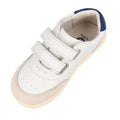 The Bobux Kids IWalk IW Champ Sneaker Chalk White Blue 650501 features two Velcro straps, a beige suede toe, and a blue heel accent—perfect unisex sneakers for everyday wear., 9420075767843, 9420075781443, 9420075780316, 9420075781368, 9420075780460