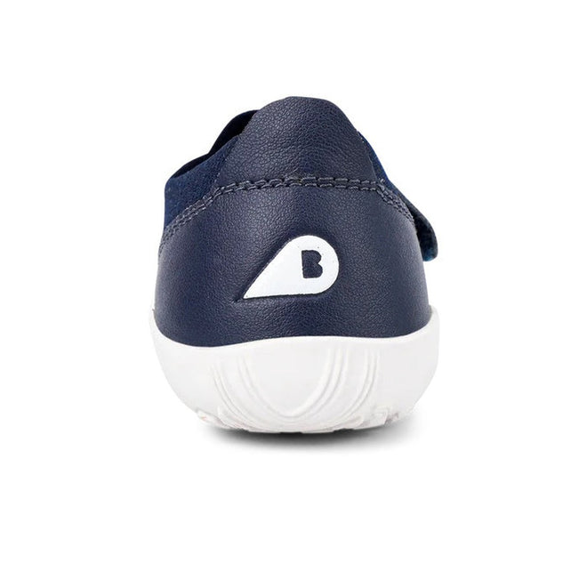 Rear view of the Bobux Iwalk Lo Dimension III Blue Navy Trainer 638506 Unisex, a lightweight navy performance shoe with a white sole and a white letter B inside a teardrop shape on the heel., 9420062025925, 9420071311699, 9420068531536, 9420071311712, 9420068531550